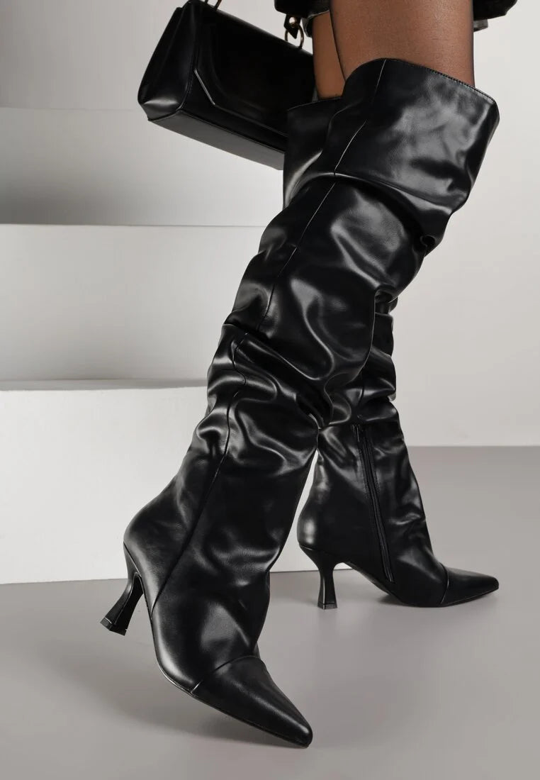 Black high boots with a thin heel