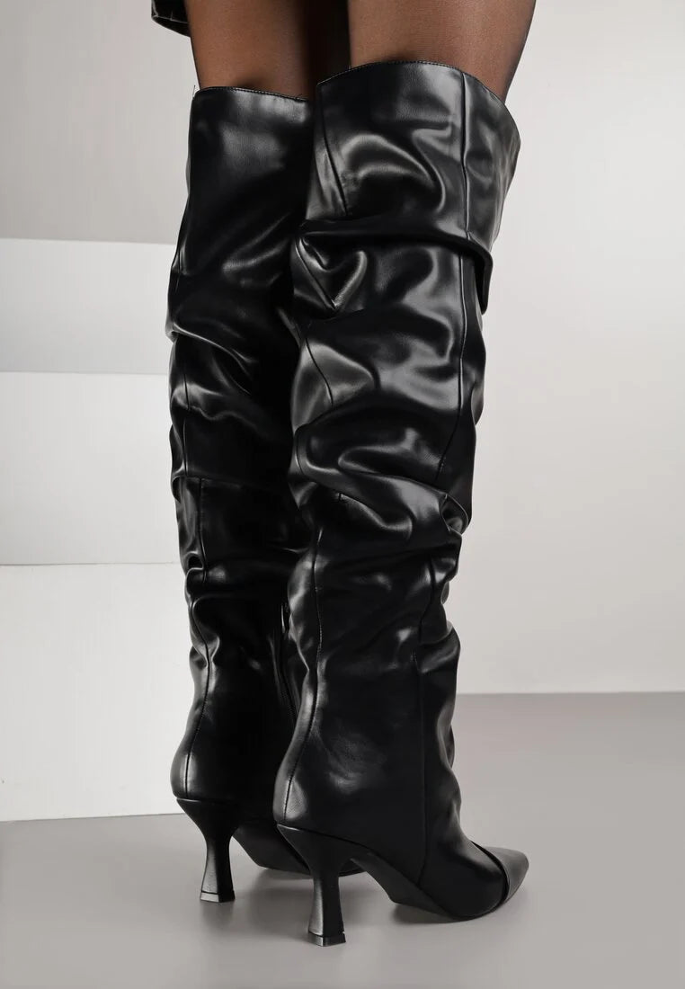 Black high boots with a thin heel