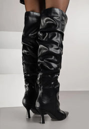 Black high boots with a thin heel