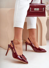 Nude thin heeled shoes.