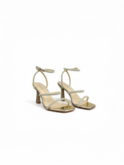 Gold sandals on a thin heel