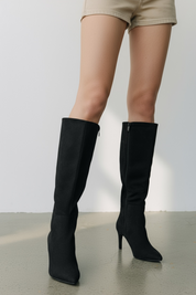 Black polished boots with a thin heel
