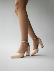 Nude block heel sandals.