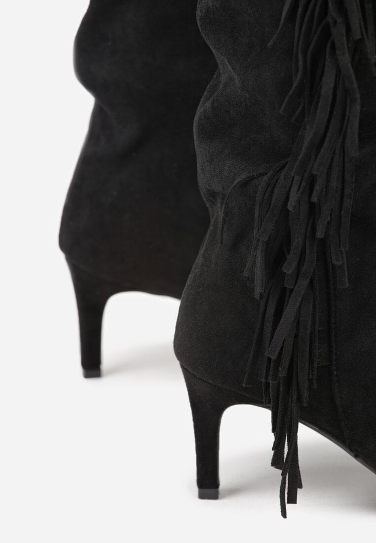 Black boots on a thin heel