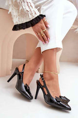 Nude thin heeled shoes.