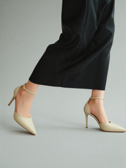 Gold heels on a thin heel