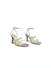 Silver sandals on a thin heel