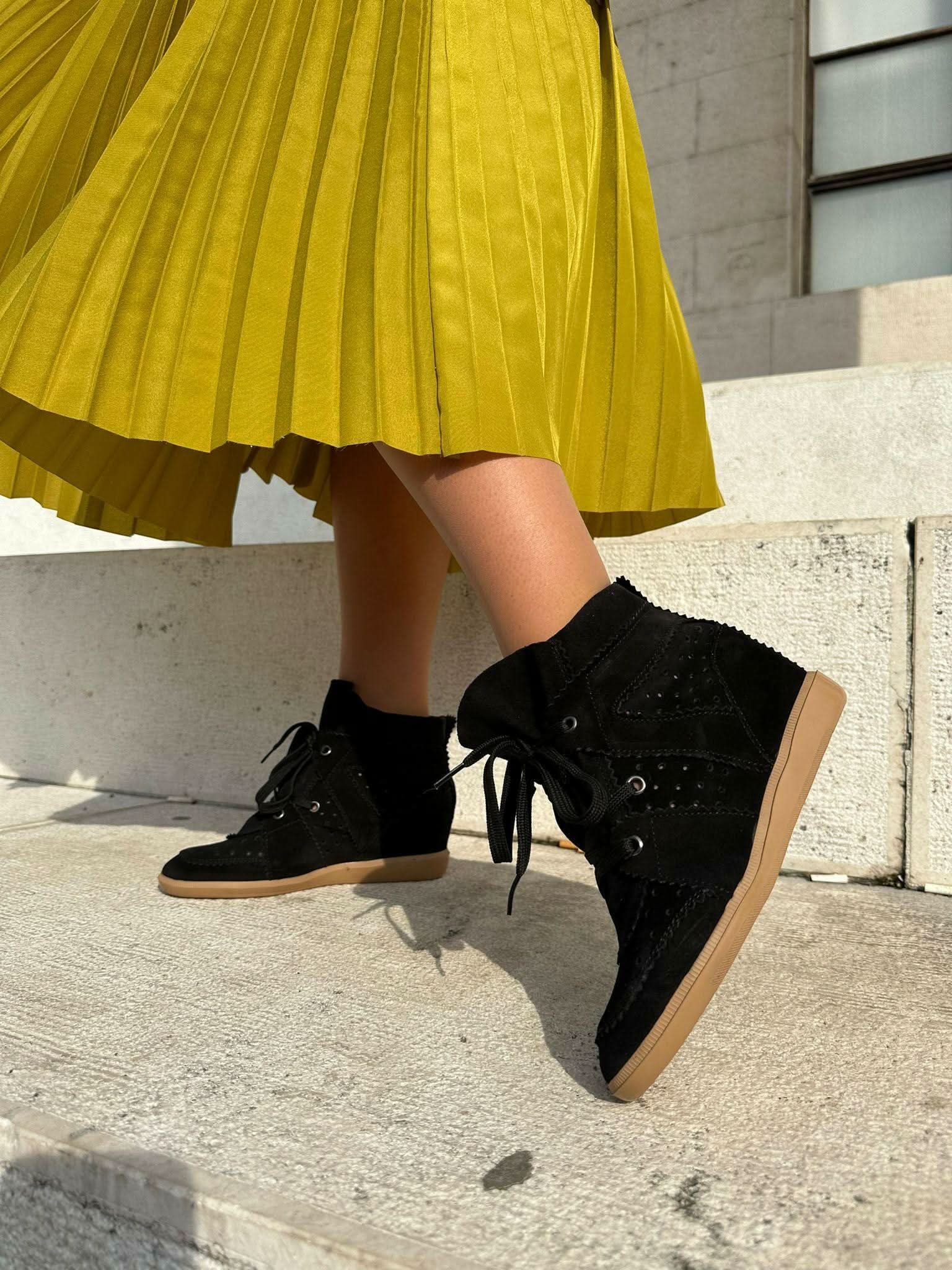 Black sneakers made of genuine leather