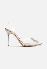 Shoes with a brooch on a thin heel